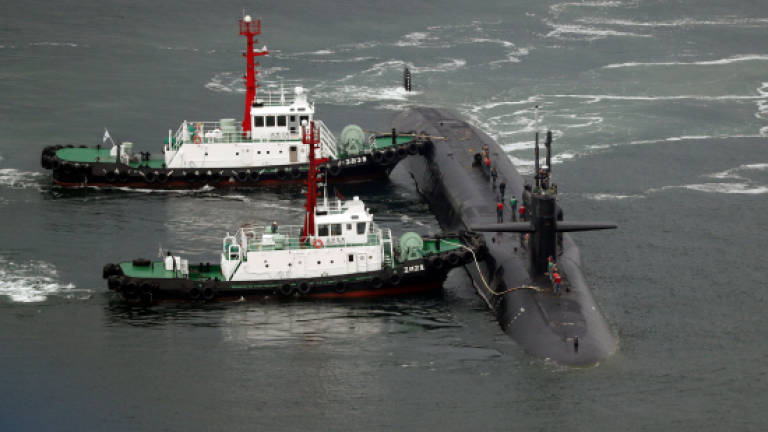 US submarine makes S.Korea port call, North remains defiant