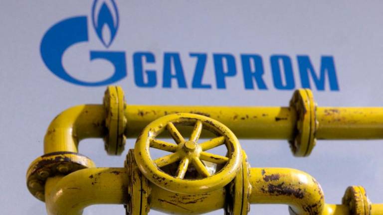 3D printed Natural Gas Pipes are placed on displayed Gazprom logo in this illustration taken, January 31, 2022. REUTERSPIX