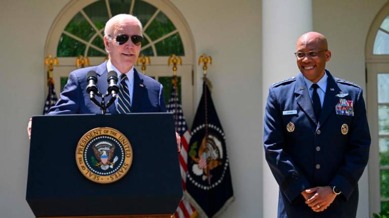 US President Joe Biden announces his nomination of Air Force General Charles Brown, Jr. (R), to serve as the next Chairman of the Joint Chiefs of Staff, in the Rose Garden of the White House in Washington, DC, May 25, 2023. AFPPIX