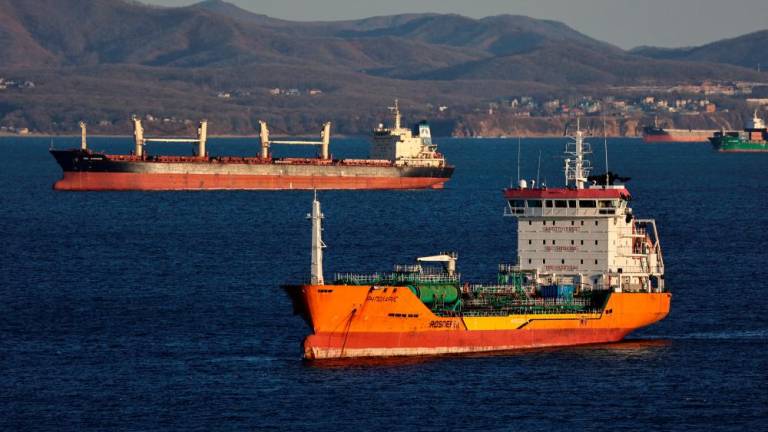 The crude oil tanker RN Polaris and a bulk carrier sail in Nakhodka Bay near the port city of Nakhodka, Russia, on Sunday. – Reuterspic