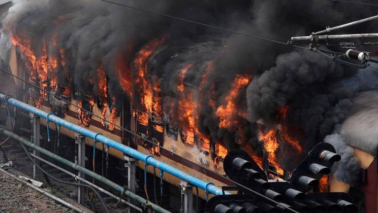 Smoke billows out from a passenger train coach after it was set on fire by protestors during a protest against “Agnipath scheme” for recruiting personnel for armed forces, in Secunderabad in the southern state of Telangana, India, June 17, 2022. REUTERSpix