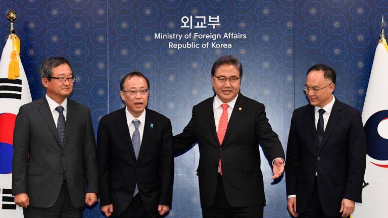 South Korean Foreign Minister Park Jin (2nd R) poses with senior deputy minister for foreign affairs of Japan Takehiro Funakoshi (2nd L), assistant minister of foreign affairs of China Nong Rong (R) and deputy minister for political affairs of South Korean foreign ministry Chung Byung-won (L) pose ahead of South Korea, China and Japan trilateral metting at the foreign ministry in Seoul on September 25, 2023. AFPPIX