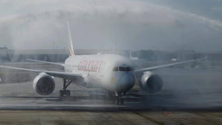 SEPANG, March 26 -- Malaysia welcomes Ethiopian Airlines flight, Boeing 787s with a water cannon salute after safely arrived at Kuala Lumpur International Airport (KLIA) Terminal 1 today. - BERNAMAPIX