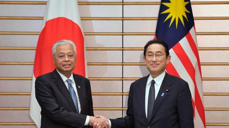 Prime Minister Datuk Seri Ismail Sabri Yaakob (left) meeting with the Prime Minister of Japan, Fumio Kishida at the Japanese Prime Minister’s Office on Friday. BERNAMApix