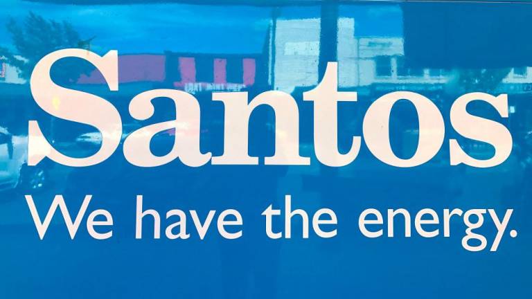FILE PHOTO: A sign for Santos Ltd is displayed on the front of the company's office building in the rural township of Gunnedah, located in north-western New South Wales in Australia, March 9, 2018. Picture taken March 9, 2018. - REUTERSPIX