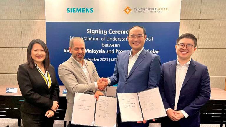 From left: Siemens Asean &amp; Malaysia finance, digital industries head Thang Yuet Yeng, Danze, Porgressture Solar co-founder &amp; CEO Cliff Siaw and Ng.