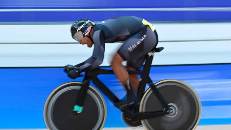 Malaysia’s Muhammad Shah Firdaus Sahrom competes in the men’s sprint 1/16 finals of the cycling track event during the 2022 Asian Games in Hangzhou in China’s eastern Zhejiang province on September 27, 2023/AFPPix