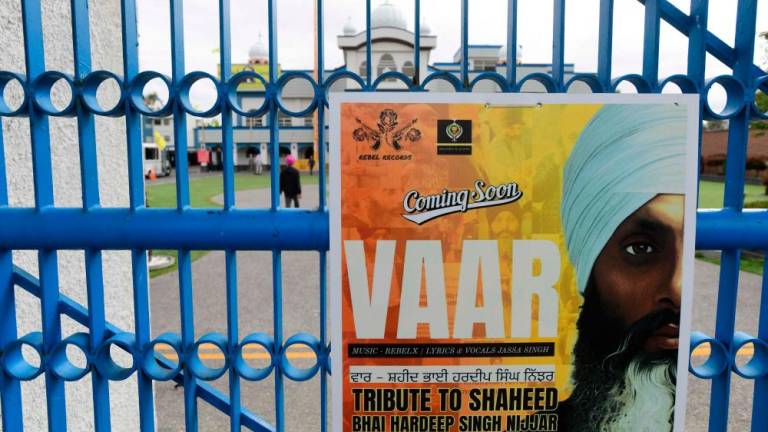 A poster advertising a tribute for the former Gurdwara President Jathedar Hardeep Singh Nijjar is displayed at the Guru Nanak Sikh Gurdwara temple in Surrey, British Columbia//AFPix