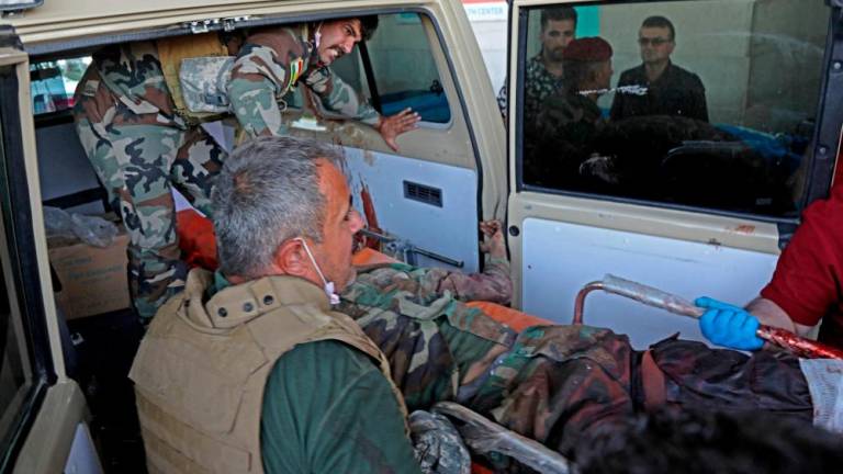 A wounded member of the Kurdish Democratic Party is transported to a hospital following strikes by Iran on the village of Altun Kupri, south of the capital Arbil, in Iraq’s autonomous Kurdistan region on September 28, 2022. AFPPIX