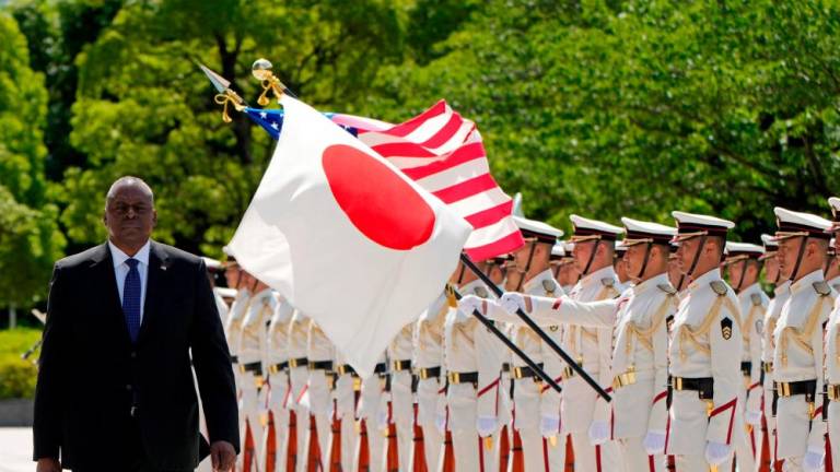US Secretary of Defense Lloyd Austin reviews a guard of honor at the Defense ministry in Tokyo on June 1, 2023/AFPpix
