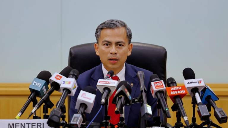 Communications and Digital Minister Fahmi Fadzil at a press conference after the post-cabinet meeting here today. - BERNAMAPIX