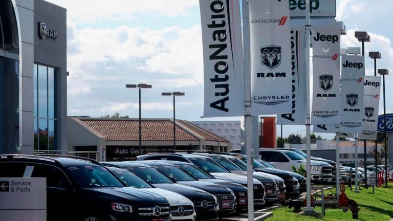 Vehicles are displayed for sale at a car dealership in Valencia, California. US new vehicle sales in September finished at 1.11 million units, with an annual sales rate of 13.49 million, according to Wards Intelligence data. – AFPpix