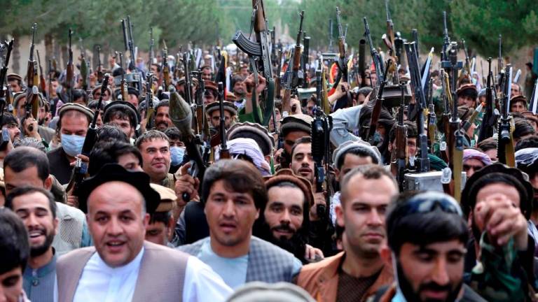 File pix: Hundreds of armed men attend a gathering to announce their support for Afghan security forces and that they are ready to fight against the Taliban, on the outskirts of Kabul, Afghanistan June 23, 2021/REUTERS PIX