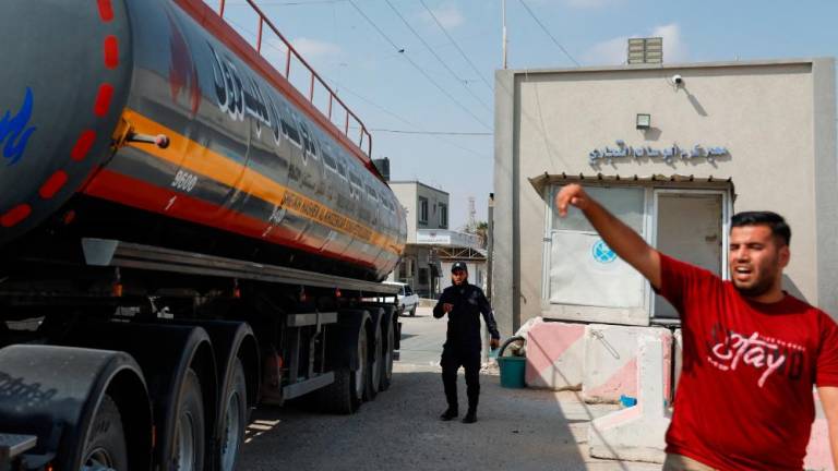 A truck carrying fuel imports for the lone power plant rolls into Gaza, after Israel eased up closures, as ceasefire holds in Rafah in the southern Gaza Strip, August 8, 2022. REUTERSPIX