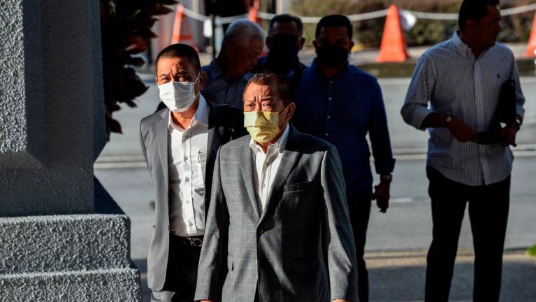 KUALA LUMPUR, Sept 23 -- Member of Parliament for Kinabatangan Datuk Seri Bung Moktar Radin (second, left) arrived at the Kuala Lumpur Court Complex today for a trial to defend himself on three charges related to corruption amounting to RM2.8 million involving Public Mutual Berhad unit trust investments, seven years ago. BERNAMAPIX