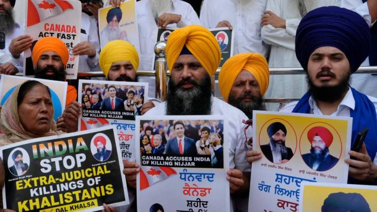 Activists of the Dal Khalsa Sikh organisation, a pro-Khalistan group, stage a demonstration demanding justice for Sikh separatist Hardeep Singh Nijjar, who was killed in June 2023 near Vancouver, after offering prayers at the at Akal Takht Sahib in the Golden Temple in Amritsar on September 29, 2023. AFPPIX