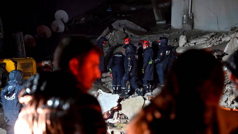 Rescue personnel search for victims and survivors through the rubble of buildings in Kahramanmaras, Turkey, after a 7.8-magnitude earthquake struck the country’s southeast on February 7, 2023. AFPPIX