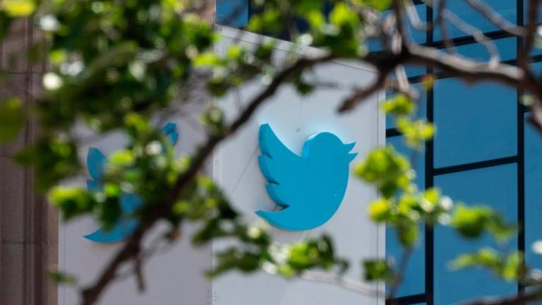 The Twitter logo is seen at the company’s headquarters in downtown San Francisco, California. Twitter has urged its shareholders to vote in favour of Musk’s buyout for US$54.20 per share in cash. AFPpix