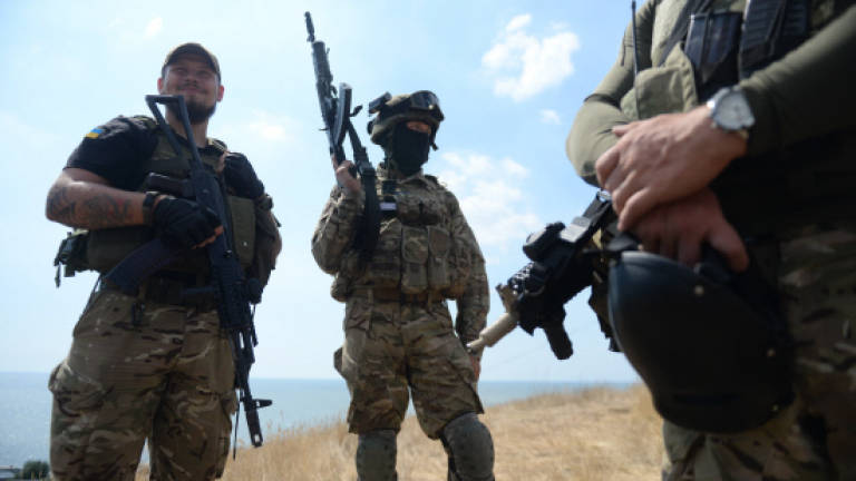 Captured Russian paratroopers return home in swap with Ukraine