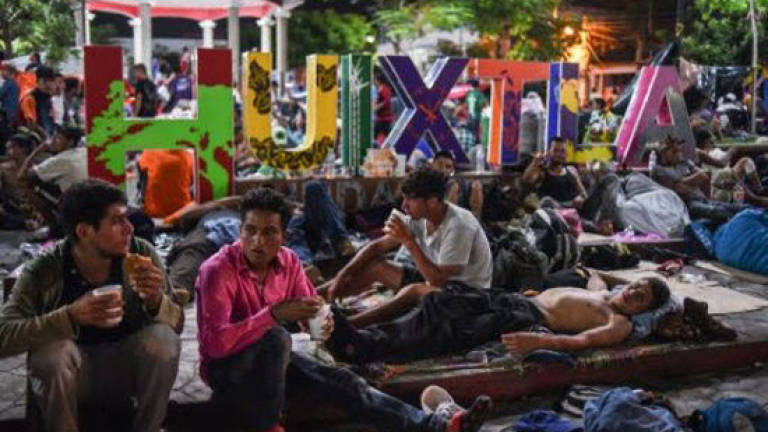 Migrant caravan stops to rest in Mexico amid Trump threats