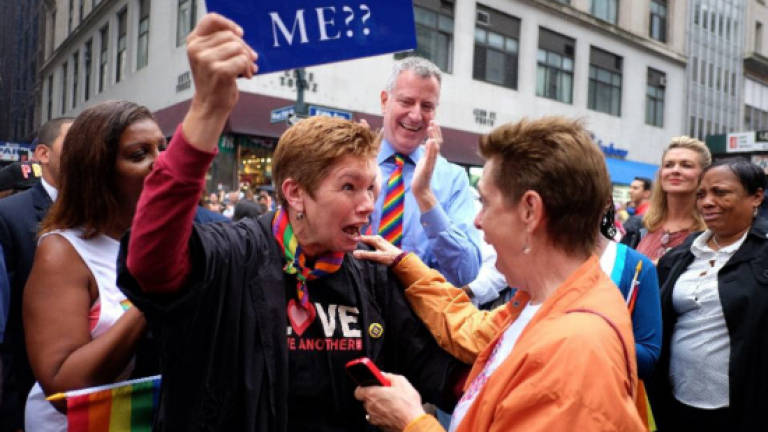 Jubilant NY crowds celebrate gay marriage ruling at pride march