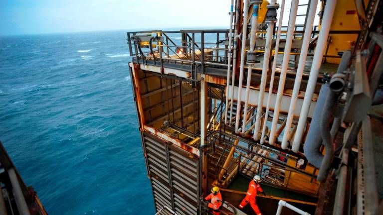Employees working on a BP oil platform in the North Sea. – Reuterspic