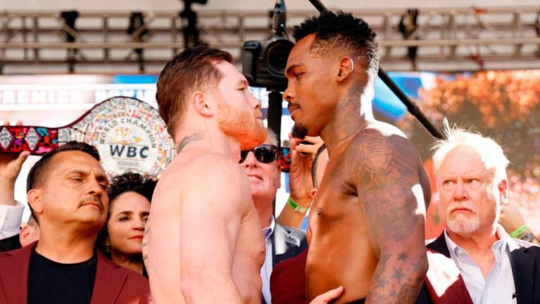 LAS VEGAS, NEVADA - SEPTEMBER 29: Undisputed super middleweight champion Saul “Canelo” Alvarez of Mexico (L) and Jermell Charlo face off during their weigh-in at Toshiba Plaza on September 29, 2023 in Las Vegas, Nevada. Alvarez will defend his titles against Charlo at T-Mobile Arena on September 30 in Las Vegas. AFPPIX