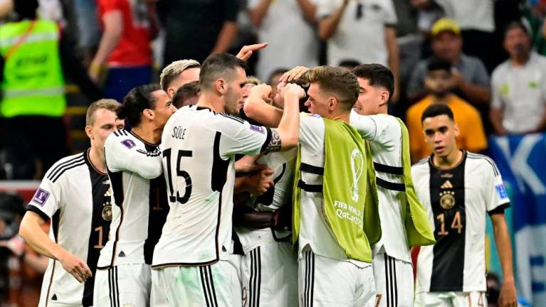 Germany’s players celebrate after Germany’s forward #09 Niclas Fullkrug scored their team’s first goal during the Qatar 2022 World Cup Group E football match between Spain and Germany at the Al-Bayt Stadium in Al Khor, north of Doha on November 27, 2022/AFPPix