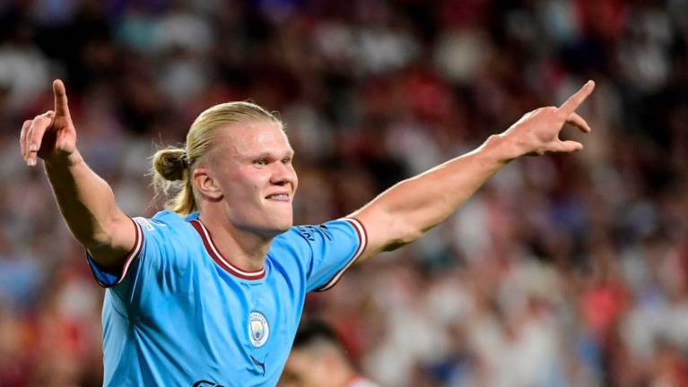 Manchester City’s Norwegian striker Erling Haaland celebrates after scoring his team’s third goal during the UEFA Champions League Group G first-leg football match between Sevilla FC and Manchester City, at the Ramon Sanchez Pizjuan stadium in Seville on September 6, 2022. AFPPIX