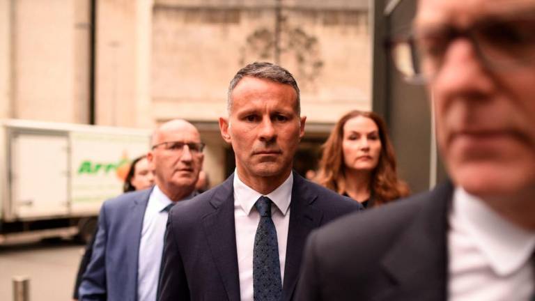 (FILES) Giggs is in the spotlight in Manchester once more on August 8, 2022 as he stands trial on charges of controlling and coercive behaviour against his former girlfriend Kate Greville between August 2017 and November 2020. AFPPIX