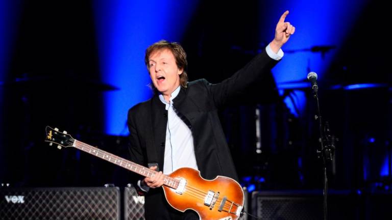 This file photo taken on May 30, 2016 shows British musician and former Beatles’ member Paul McCartney performs on stage at the Bercy stadium in Paris/AFPPix
