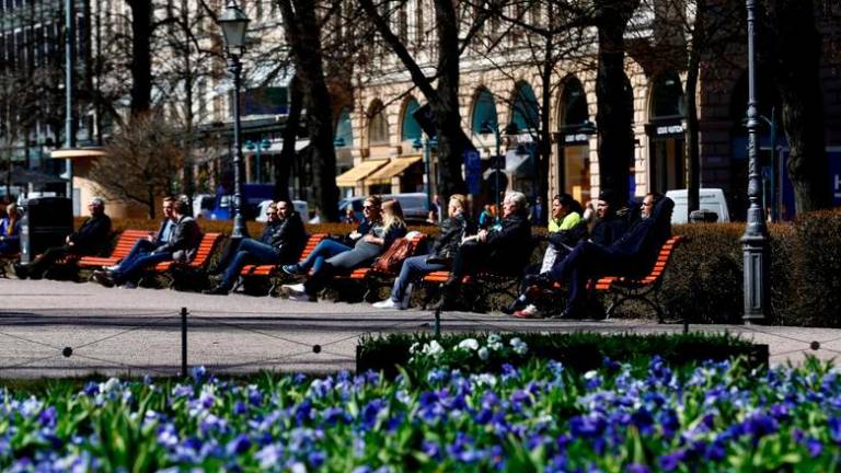 FILE PHOTO: People enjoy a sunny day at the Esplanade in Helsinki, Finland, May 3, 2017. REUTERSPIX