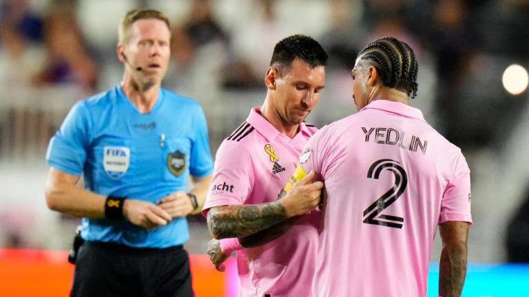 Sep 20, 2023; Fort Lauderdale, Florida, USA; Inter Miami forward Lionel Messi (10) places the captains armband on defender DeAndre Yedlin (2) during the first half at DRV PNK Stadium. REUTERSPIX