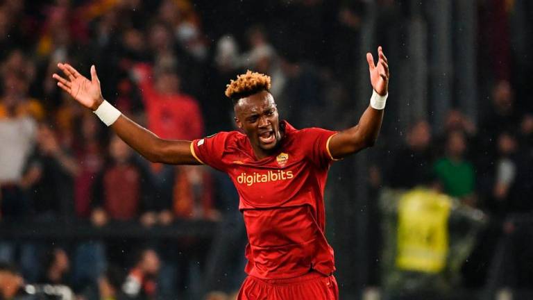 (FILES) In this file photo taken on May 05, 2022 Roma’s British forward Tammy Abraham celebrates after opening the scoring during the UEFA Conference League semi-final second leg football match between AS Roma and Leicester City at The Olympic Stadium in Rome, on May 5, 2022. AFPPIX