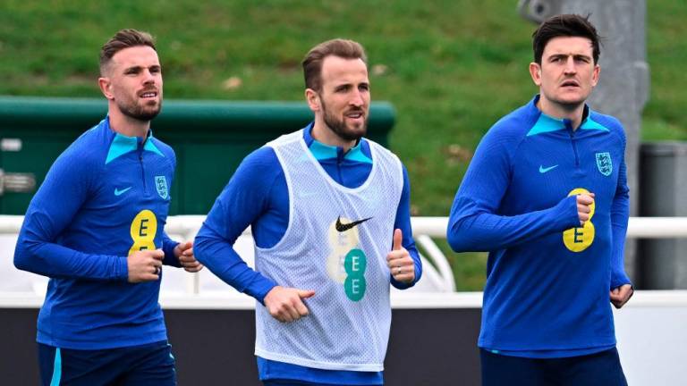 England's midfielder Jordan Henderson (L), Harry Kane (C) and Harry Maguire attend a team training session at St George's Park in Burton-on-Trent, central England, on March 21, 2023 ahead of of their UEFA EURO 2024 qualifier football match against Italy. AFPPIX