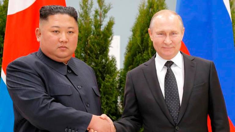 Russian President Vladimir Putin and North Korea’s leader Kim Jong Un shake hands during their meeting in Vladivostok, Russia, April 25, 2019. REUTERSPIX