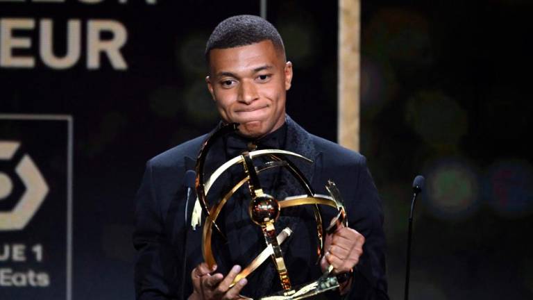 Paris Saint-Germain’s French forward Kylian Mbappe reacts after receiving the Best Ligue 1 Player award during the 31th edition of the UNFP (French National Professional Football players Union) trophy ceremony, in Paris May 28, 2023/AFPPix