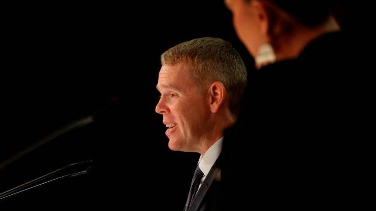 New Zealand’s new Prime Minister Chris Hipkins (L) and his Depute Prime Minister Carmel Sepuloni attend their first press conference at Parliament in Wellington on January 22, 2023. AFPPIX