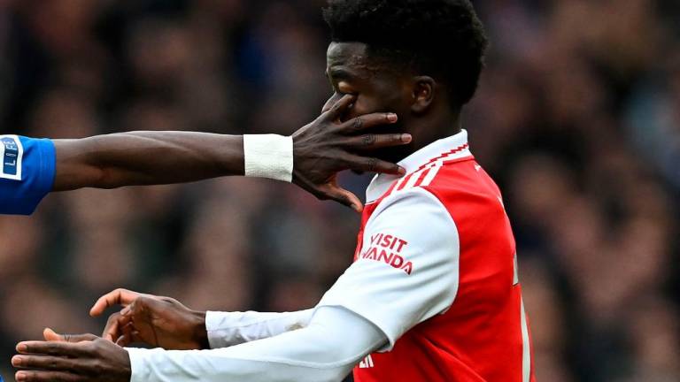 Everton's Senegalese midfielder Idrissa Gueye's finger gets into the eye of Arsenal's English midfielder Bukayo Saka (R) during the English Premier League football match between Everton and Arsenal at Goodison Park in Liverpool, north-west England, on February 4, 2023. AFPPIX
