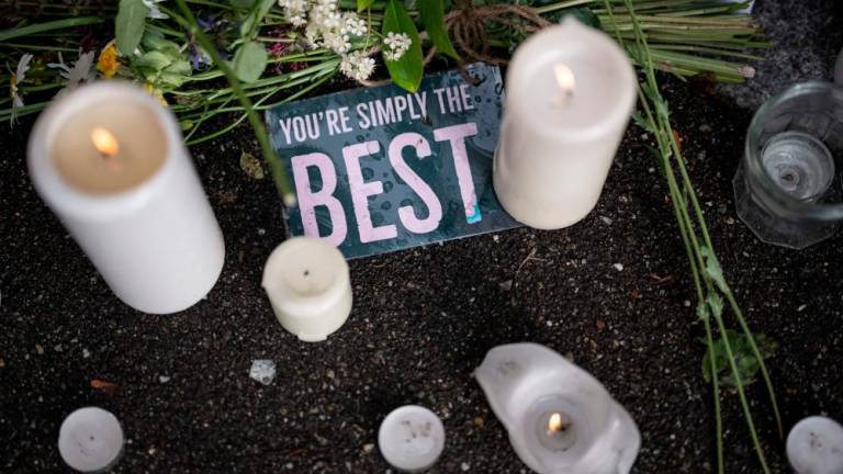 Candles and a message are seen layed outside the estate of late singer Tina Turner following the announcement of her death, in Kusnacht on May 25, 2023. AFPPIX
