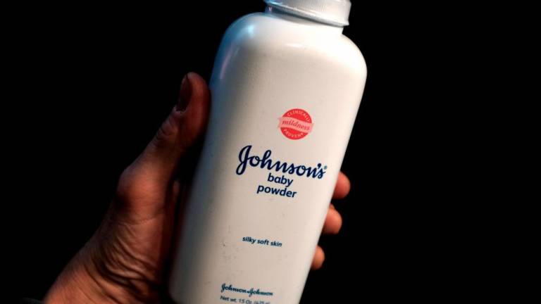 A bottle of Johnson and Johnson Baby Powder is seen in a photo illustration. – Reuterspix