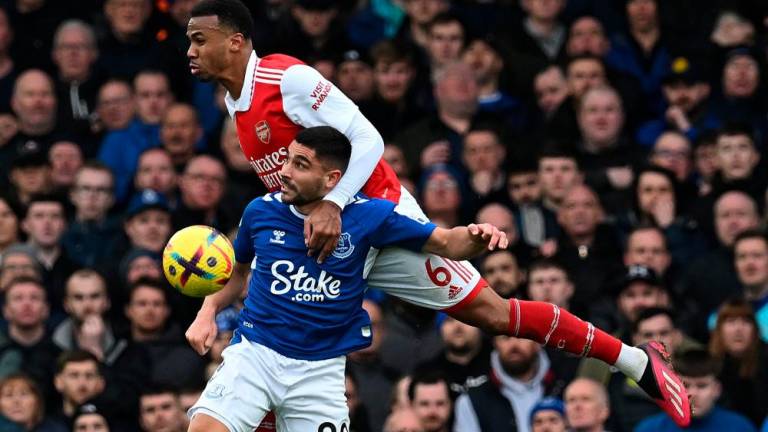 Arsenal's Brazilian defender Gabriel Magalhaes (back) heads the ball with Everton's French striker Neal Maupay during the English Premier League football match between Everton and Arsenal at Goodison Park in Liverpool, north-west England, on February 4, 2023./AFPPIC