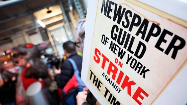 NEW YORK - DECEMBER 08: Members of the New York Times staff hold a rally outside of the New York Times headquarters as they participate in a strike on December 08, 2022 in New York City. AFPPIX
