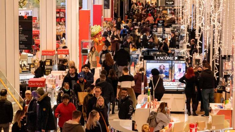 People shopping at Macy’s department store in New York City during Black Friday, Nov 25. – AFPpic