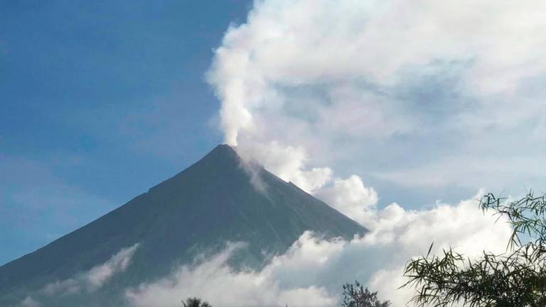 This handout photo made available by Kristin Moral shows the Mount Mayon spewing white smoke as seen from Camalig on June 8, 2023. AFPPIX