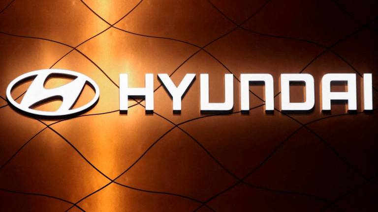 FILE PHOTO: The logo of Hyundai Motor Company is pictured at the New York International Auto Show, in Manhattan, New York City, U.S., April 13, 2022. REUTERSPIX