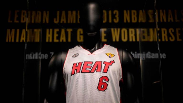 (FILES) In this file photo taken on January 20, 2023 LeBron James’ game-worn jersey from the athlete’s NBA finals game 7 victory over the Miami Heat in 2013, is on display during a press preview at Sotheby's auction House in New York City. AFPPIX