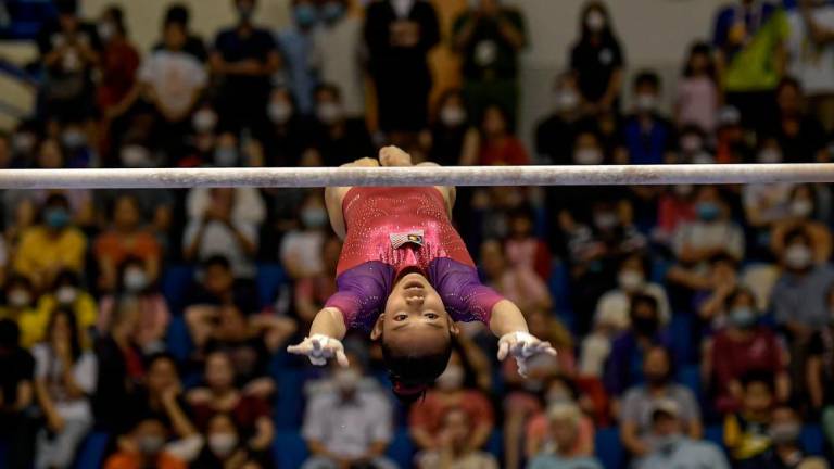 HANOI, May 15-National gymnast Rachel Yeoh Li Wen while competing in the women’s artistic gymnastics final of the Uneven Bar category at the 31st SEA Games at the Quan Ngua Sports Complex today. --BERNAMAPIX