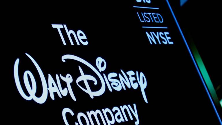 A screen shows the logo and a ticker symbol for The Walt Disney Company on the floor of the New York Stock Exchange. – Reuterspic