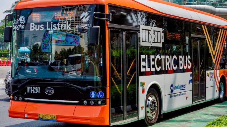 An electric bus is seen on a main road in Jakarta on June 7, 2023. The COP28 roadmap includes a ‘global goal to triple renewable energy, double energy efficiency, and double clean hydrogen, all by 2030. – AFPpic